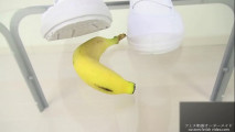 School girl crushing bananas underglass