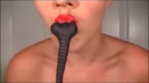 Hot girl swallows huge gummy rat